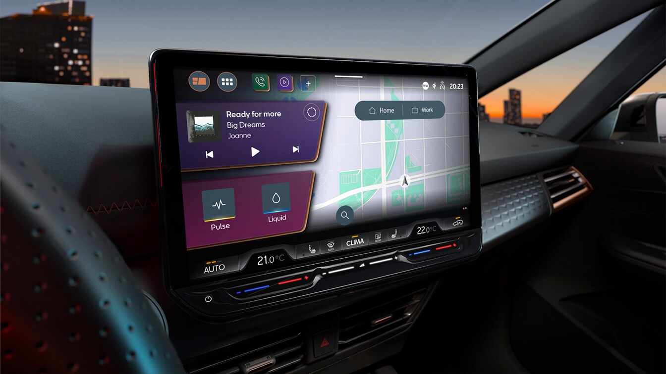 Close-up of a CUPRA car's infotainment touchscreen displaying a split-screen interface with a navigation map, music player, and climate settings, with a city skyline at sunset visible through the windshield.